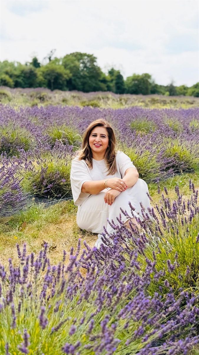 Huma in a lavender field, warm and approachable